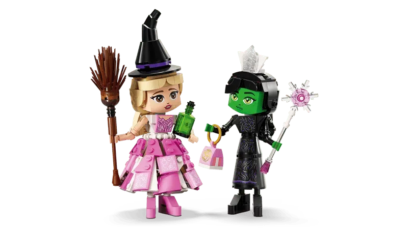 Lego Elphaba & Glinda figures with swapped accessories.