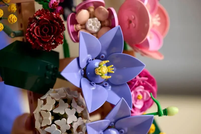 Close-up of purple and white LEGO flowers