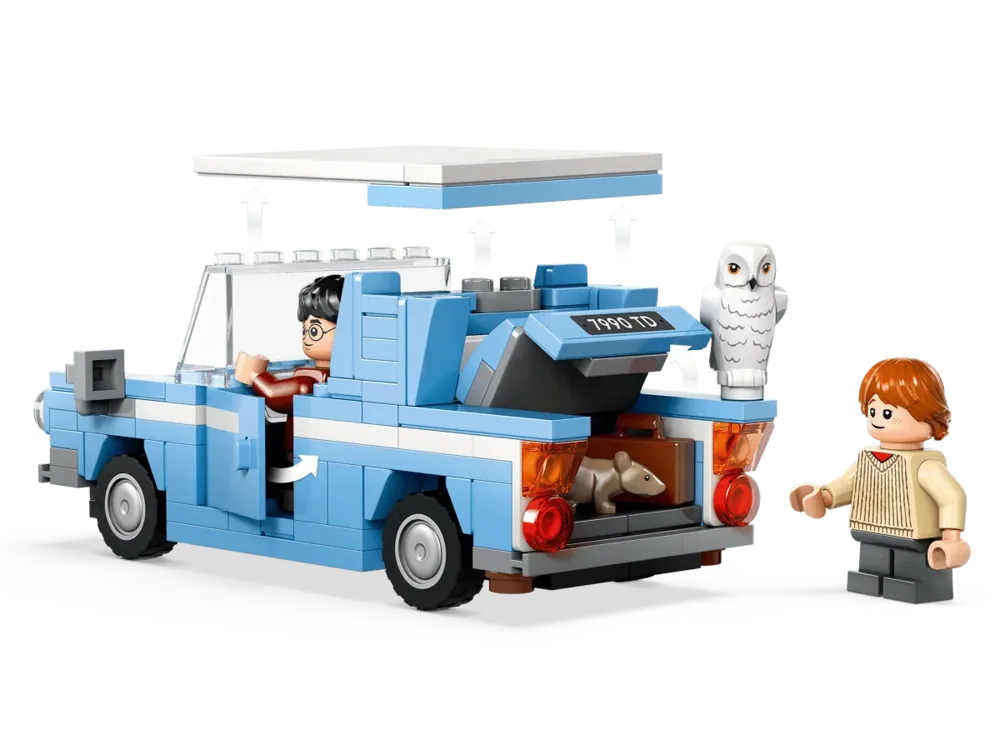 Ford Anglia with open roof and trunk.