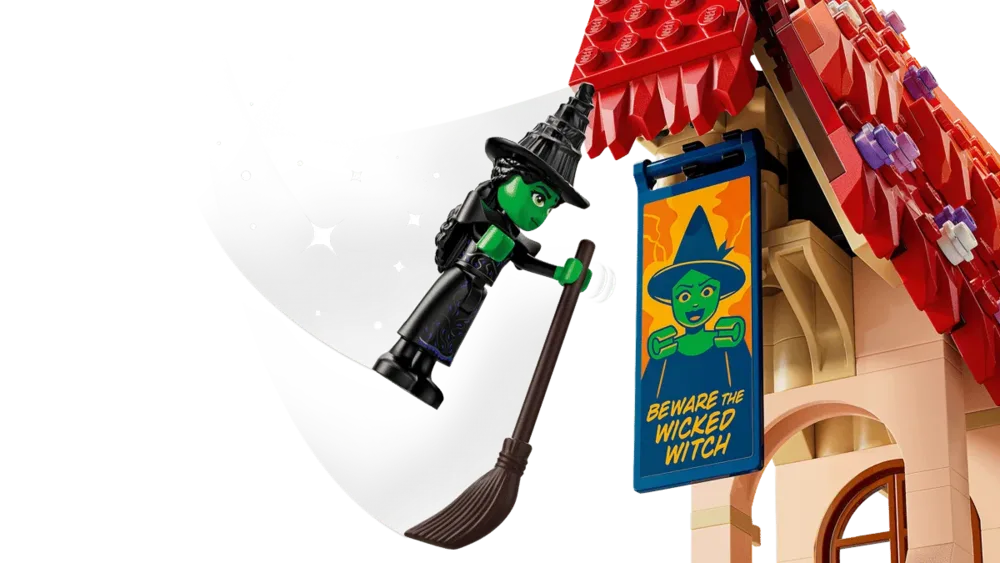 Elphaba flying past banner.