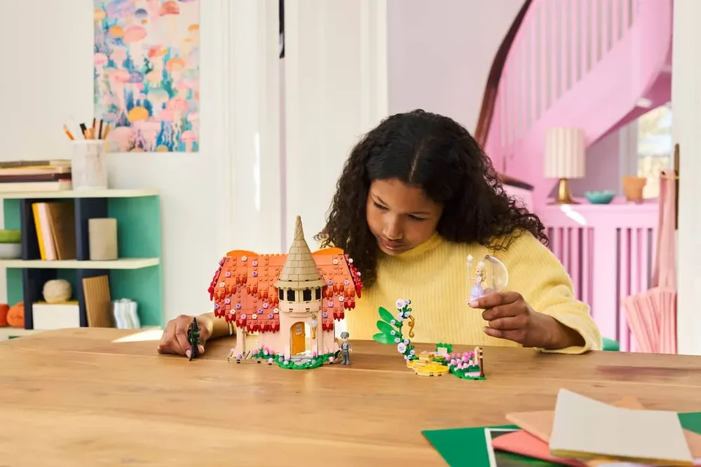 Child playing with LEGO Wicked.