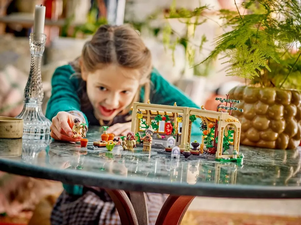 Child playing with Professor Sprout.