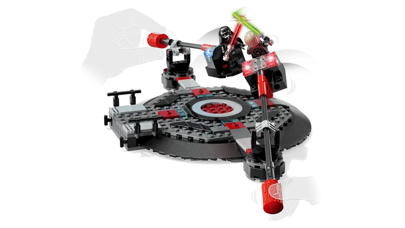 Close-up of the LEGO Star Wars 75427 Throne Room Duel play feature, showing Luke Skywalker and Darth Vader minifigures on dynamic, movable platforms engaged in a lightsaber battle, with hands controlling the movement.