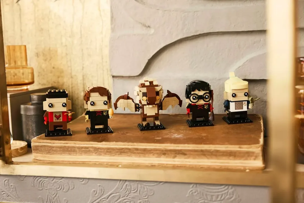 BrickHeadz display on wood.