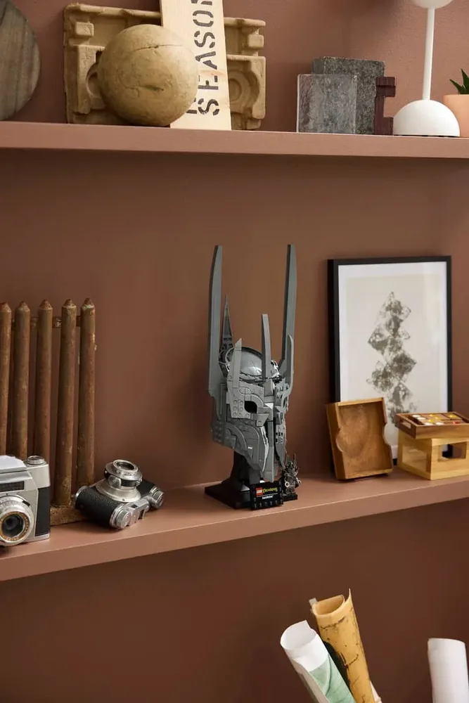 Sauron's Helmet on brown shelf.