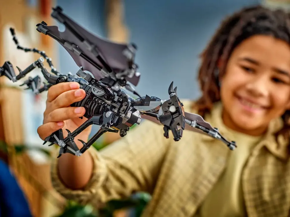 Child holding adult Thestral.