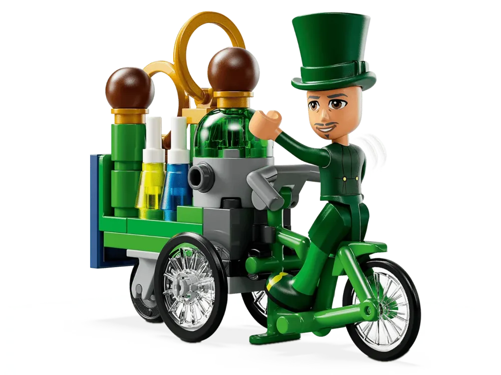 Lego minifigure on a green tricycle.