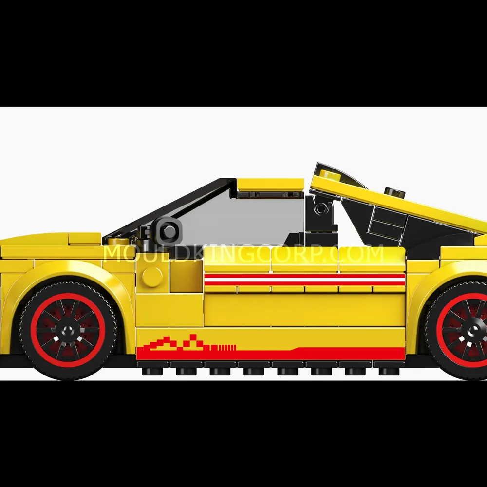 Side view of yellow rally car