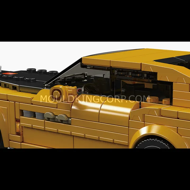 Close-up side view of the Mould King Spectre Electric Luxury Coupe 27136, showing the yellow body, black roof, and detailed side panels.