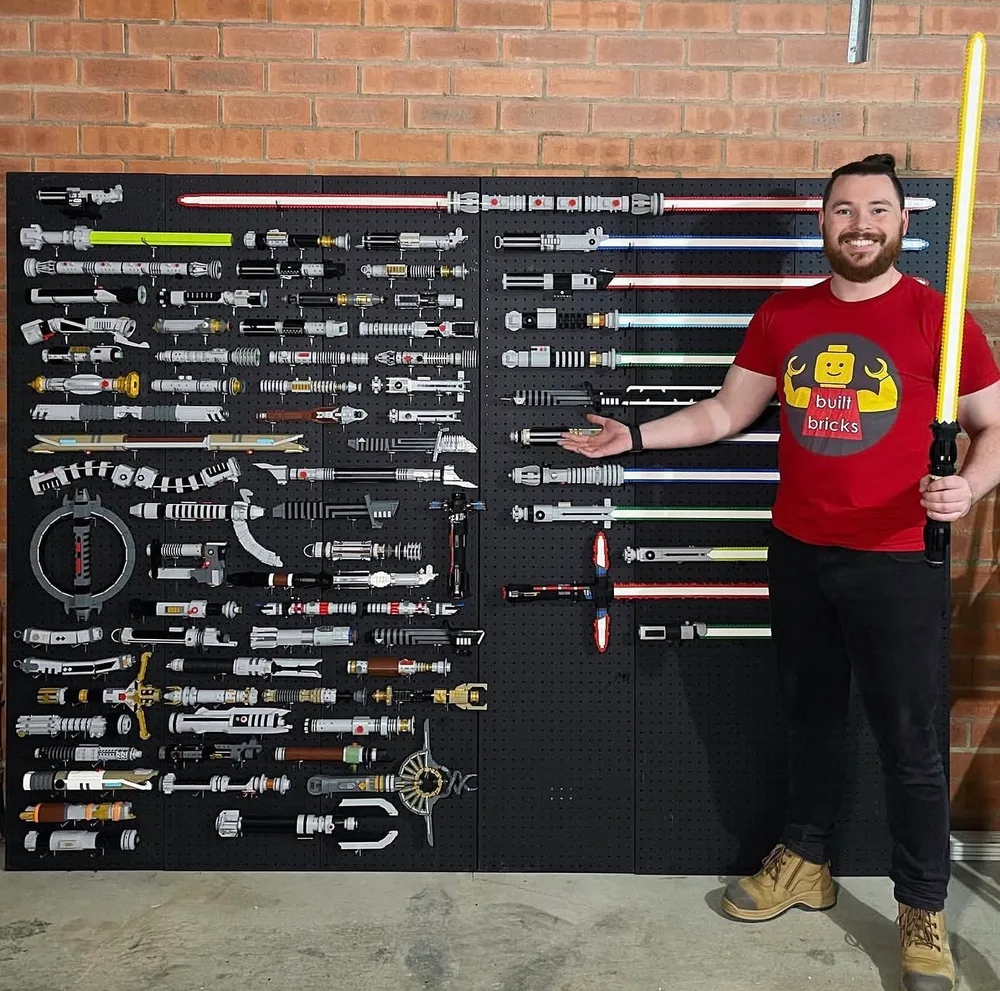 Lewis Meeny in front of LEGO Lightsaber Replica Wall