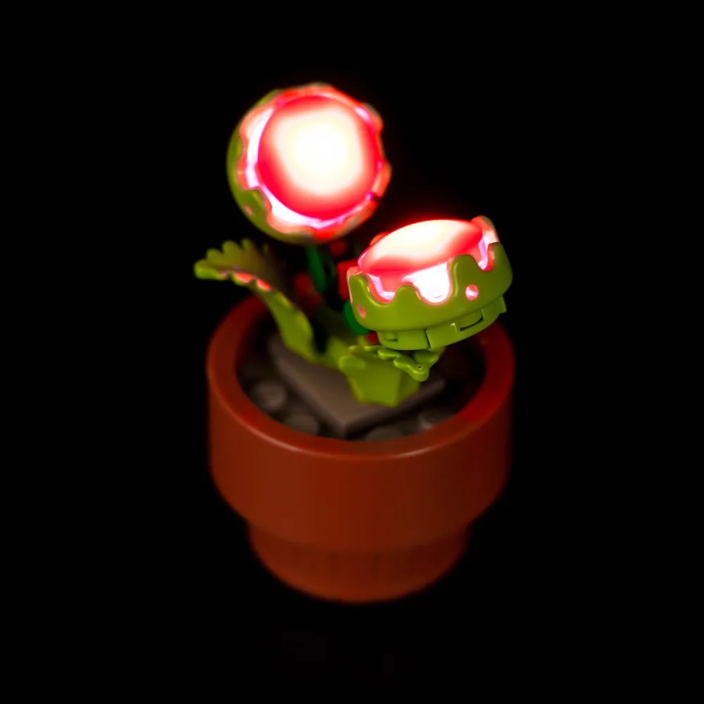Close-up of BrickBling modular micro-LEDs hidden within LEGO Tiny Plants pots