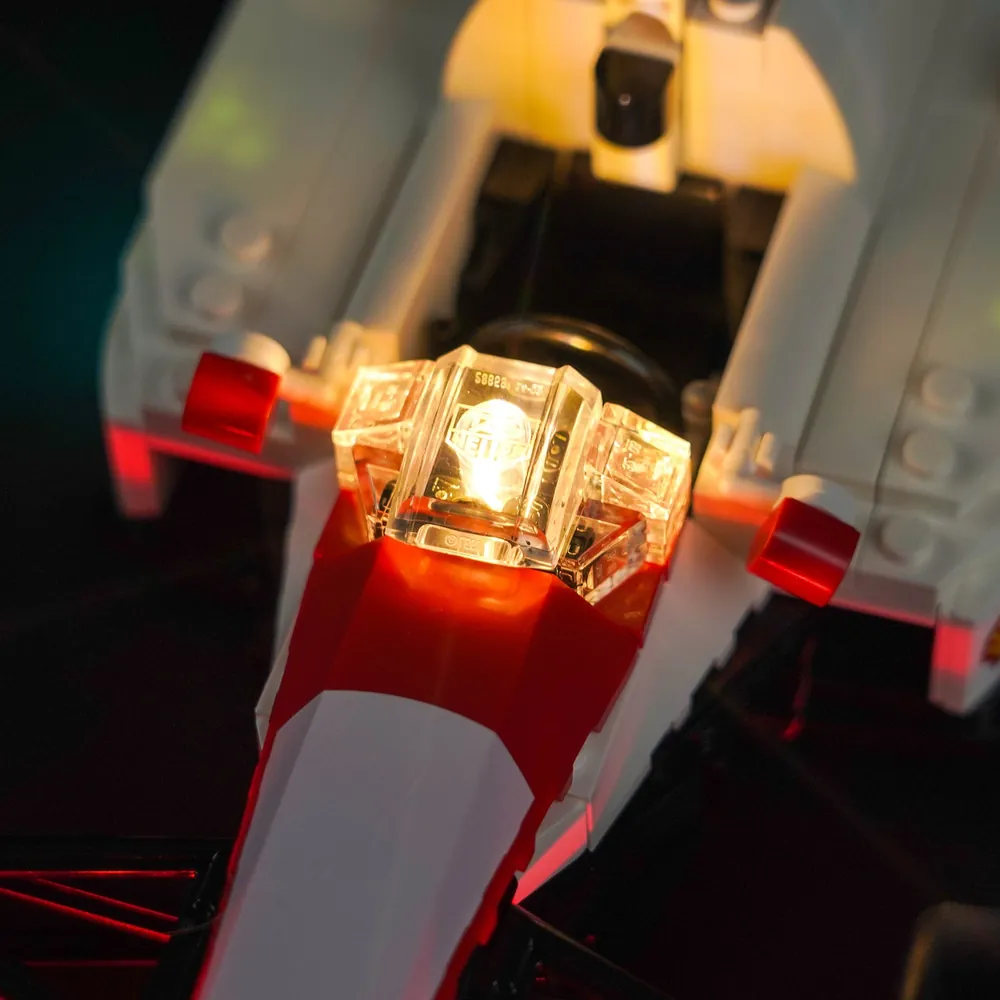 Close-up of BrickBling's micro-LED wiring on the LEGO McLaren front suspension