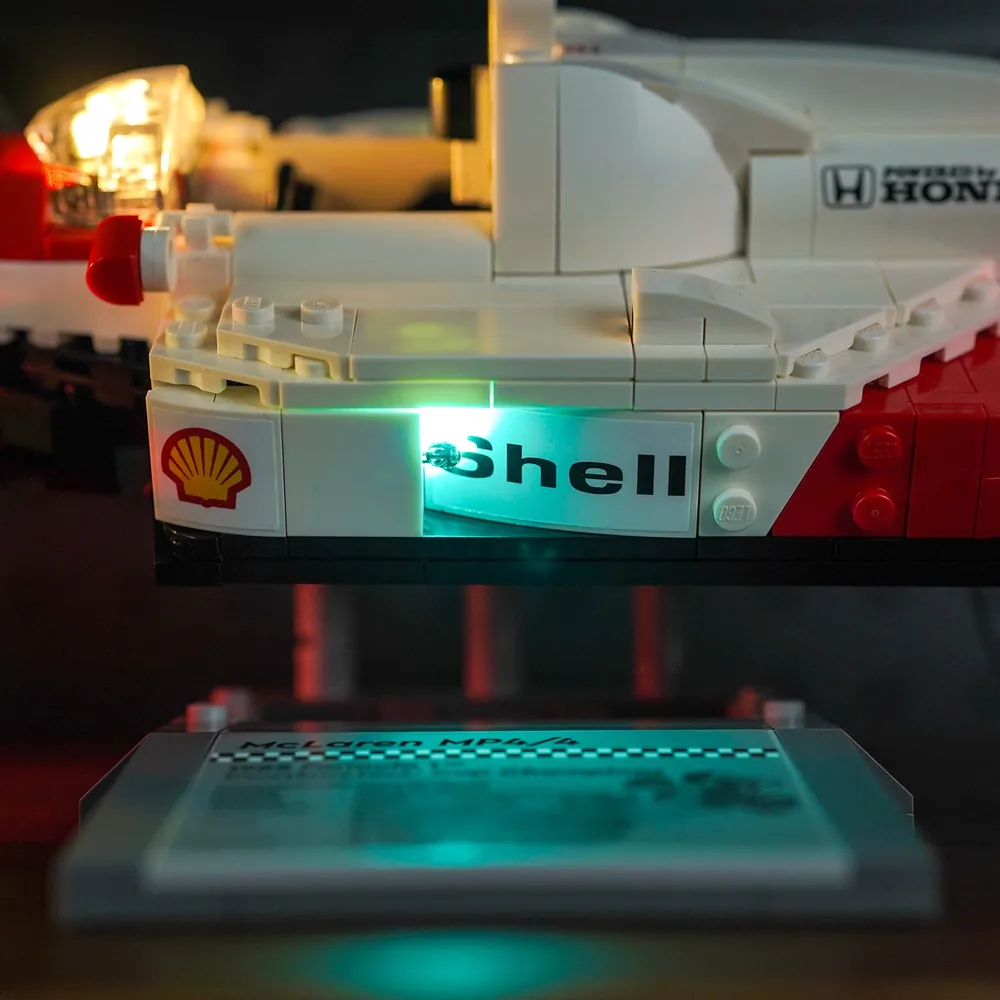 LEGO McLaren MP4/4 on display with BrickBling accent lights, featuring the Senna minifigure in foreground