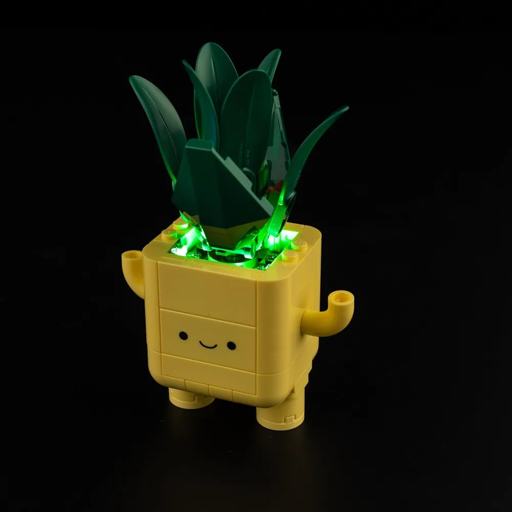 Both happy plants glowing with Game of Bricks LED lighting