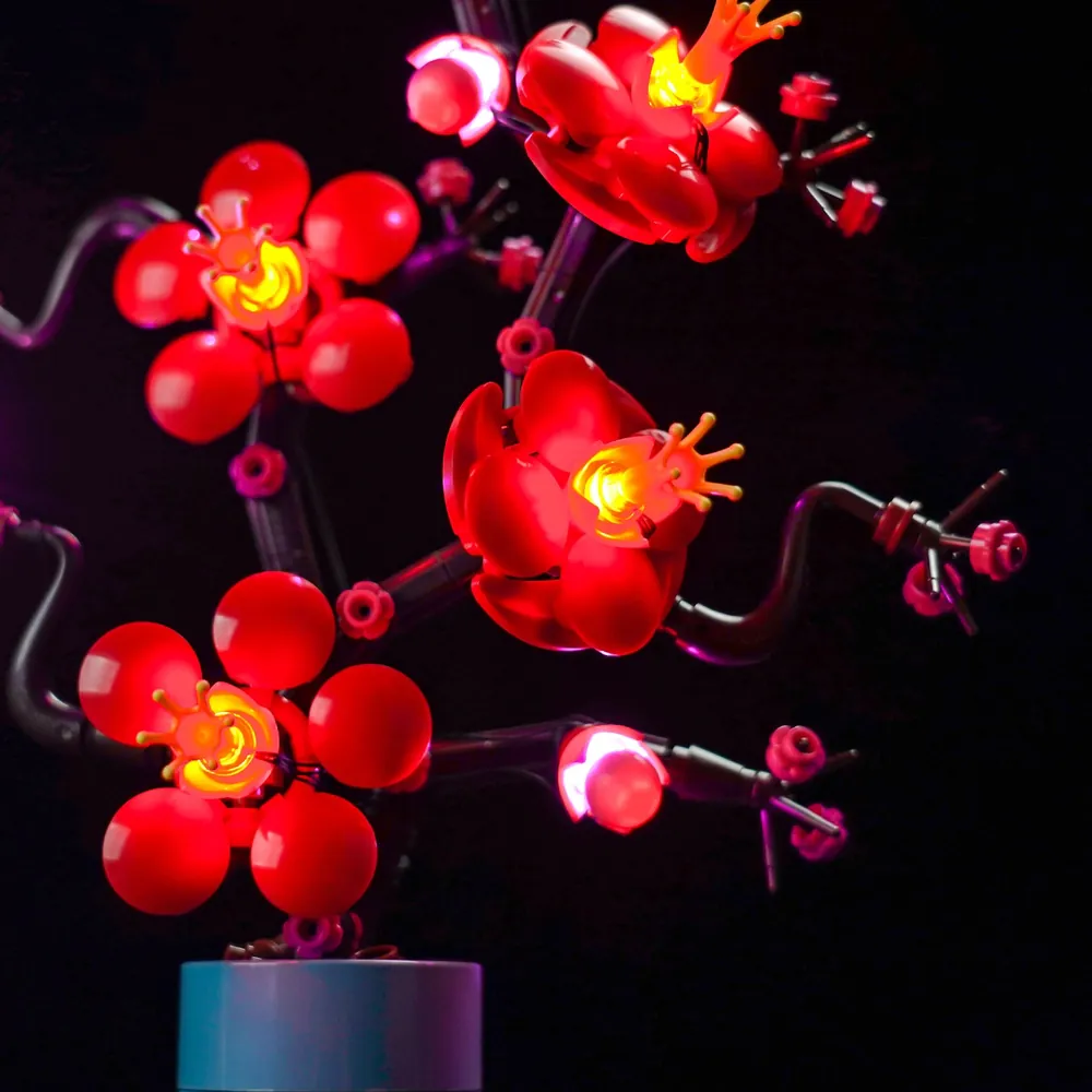 Close-up of BrickBling LED wires along LEGO branches