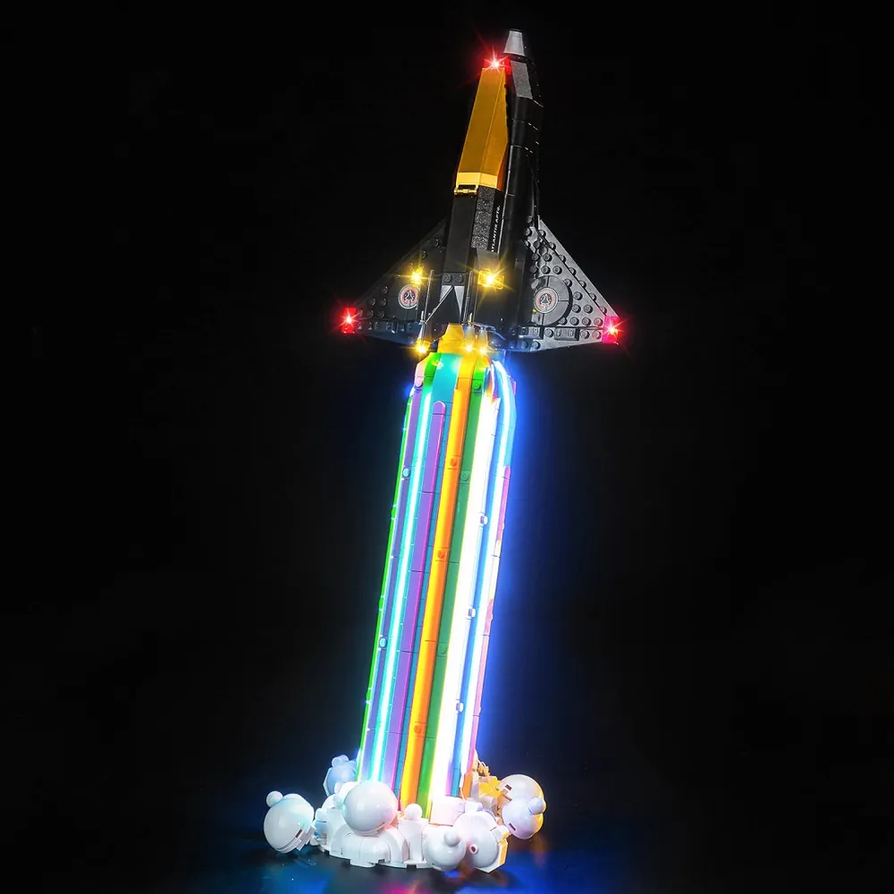 BrickBling LED kit for LEGO Over the Moon with Pharrell Williams illuminating the moon and Pharrell minifigure