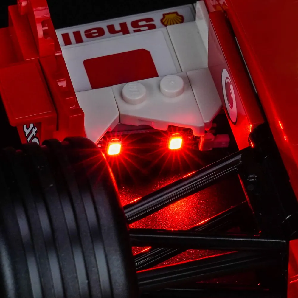 Close-up of BrickBling micro-LEDs on LEGO Ferrari F2004 front suspension and side pods