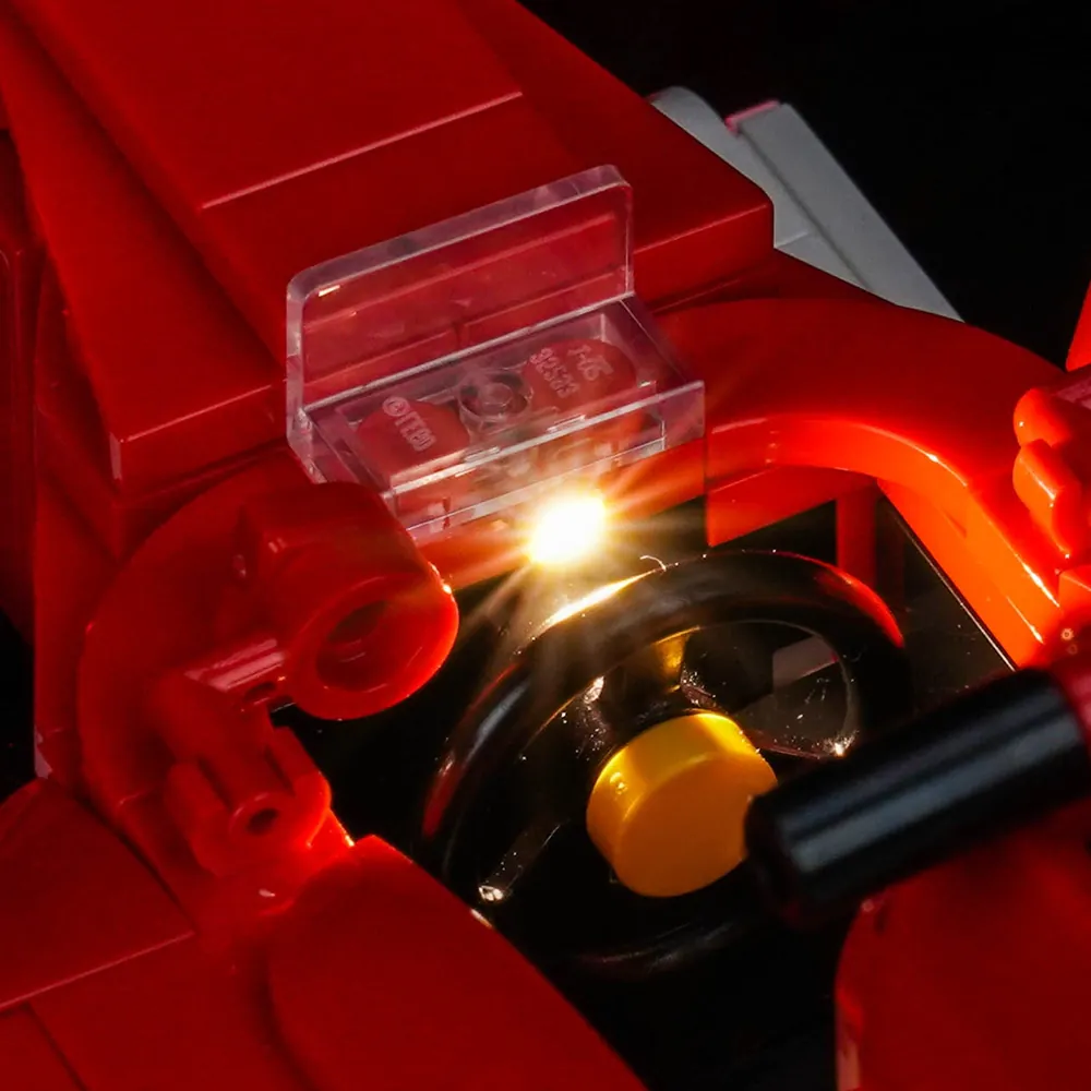 LEGO Ferrari F2004 11375 displayed with BrickBling lights, showing engine bay illumination