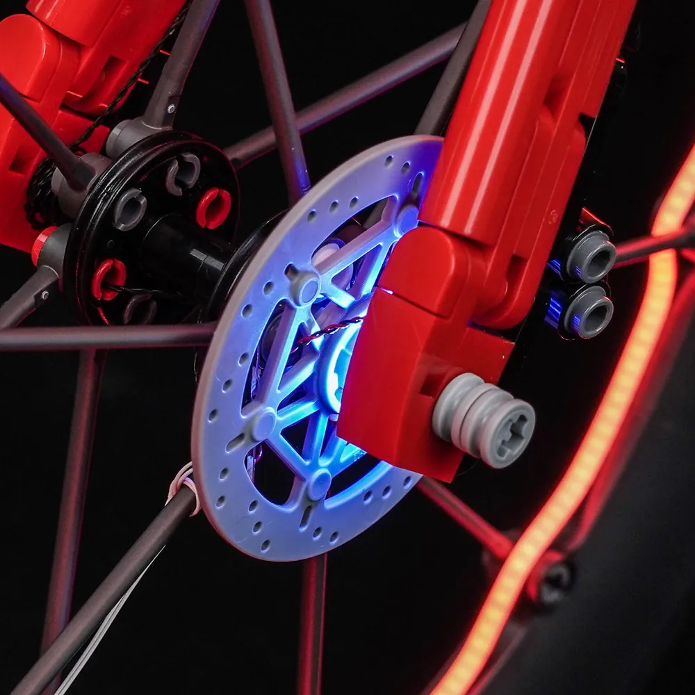 BrickBling light kit installed on LEGO Icons Road Bike showing frame and wheel accents