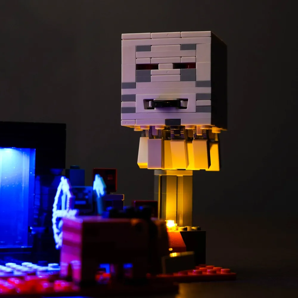 LEGO Minecraft 21255 with BrickBling lights in a dark display setting