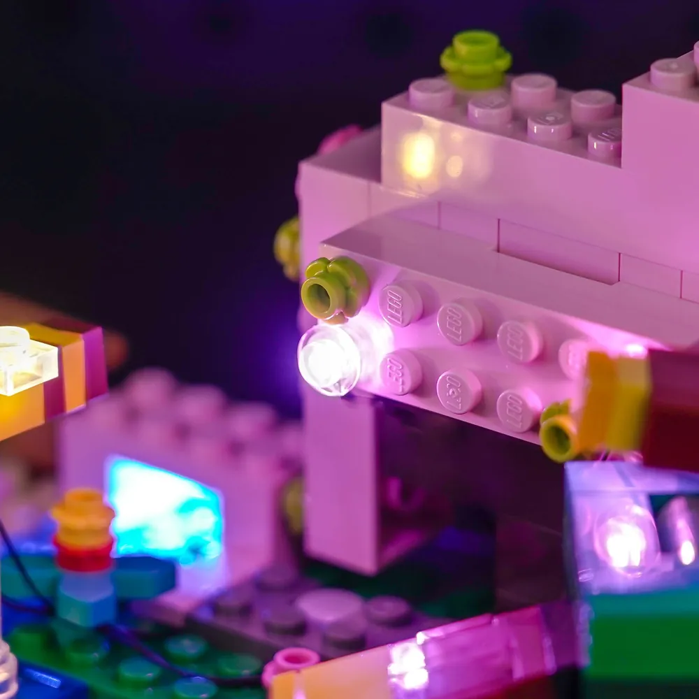 Close-up of brick-built cherry blossoms and modular micro-LEDs on LEGO 21260