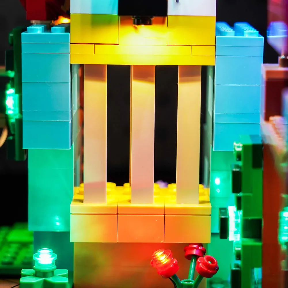 Close-up of BrickBling modular micro-LEDs installed in the LEGO Parrot Houses set