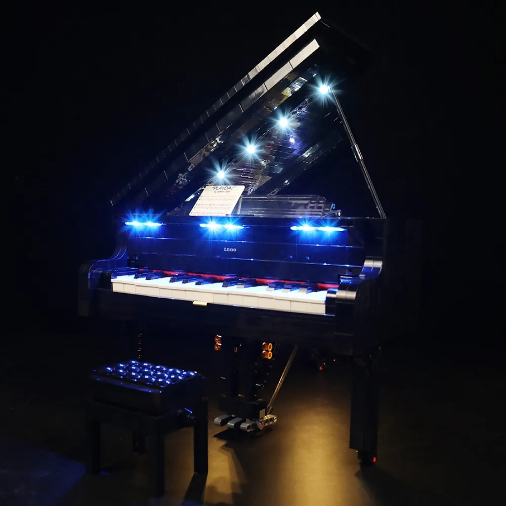 BrickBling Grand Piano LED kit showing warm white lights under the fallboard