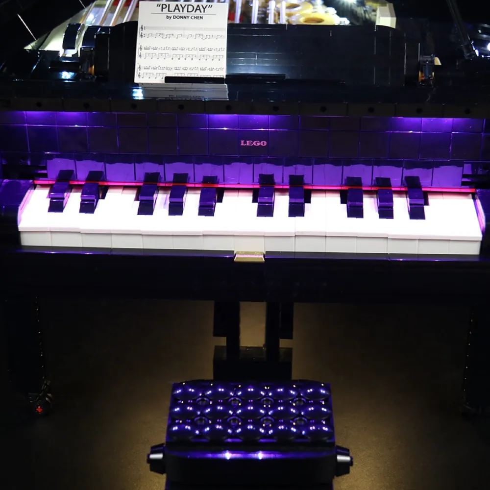 LEGO Grand Piano with BrickBling lights highlighting the keys from above