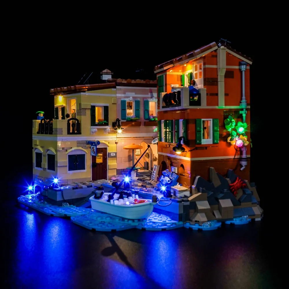 BrickBling LED kit illuminating the LEGO Italian Riviera 21359 harbor and buildings
