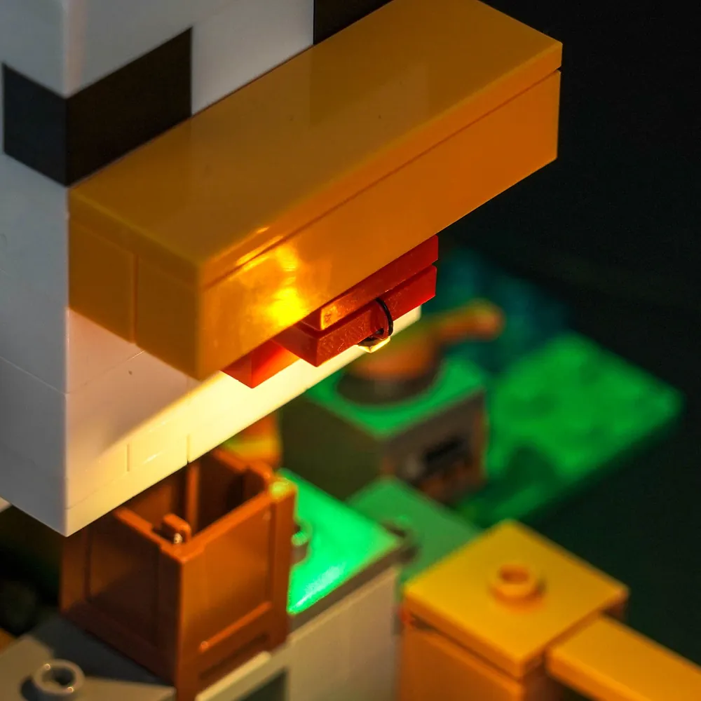 Close-up of BrickBling modular micro-LED wiring on LEGO Minecraft Chicken Farm 21585