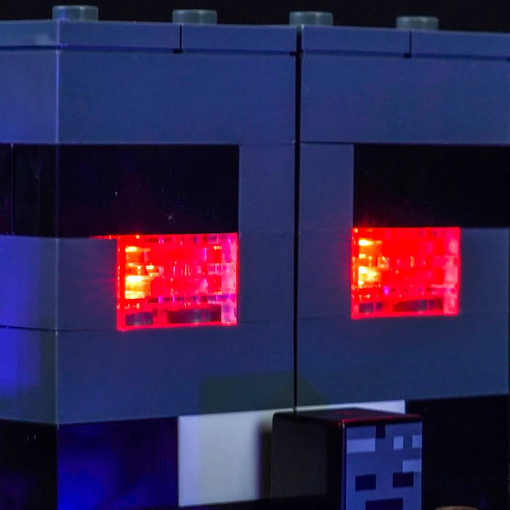 Close-up of BrickBling micro-LEDs illuminating the dark bluish gray and orange areas of the Wither Battle set