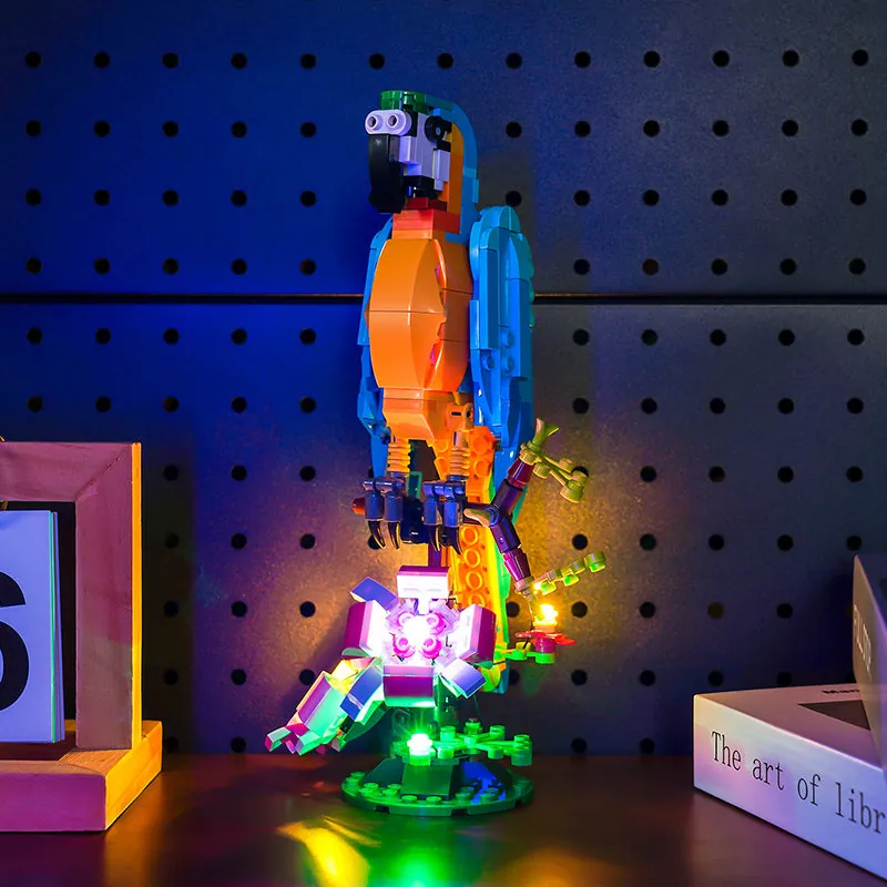 Three LEGO 31136 builds with BrickBling lighting, with parrot as the primary focus