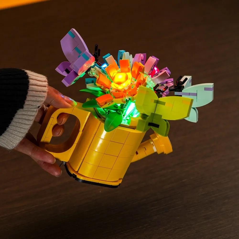 LEGO watering can display with controlled lighting zones