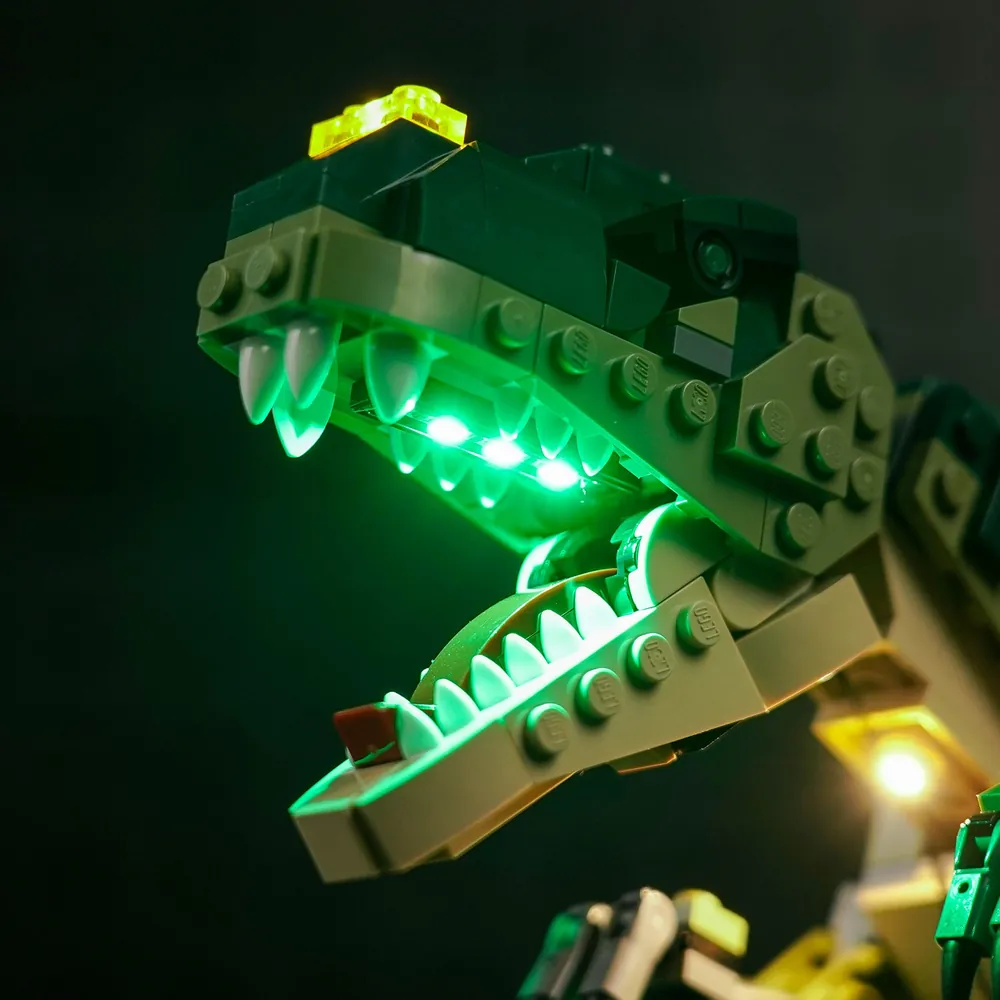 Close-up of BrickBling modular micro-LED wiring tucked under LEGO plates on T. rex 31151