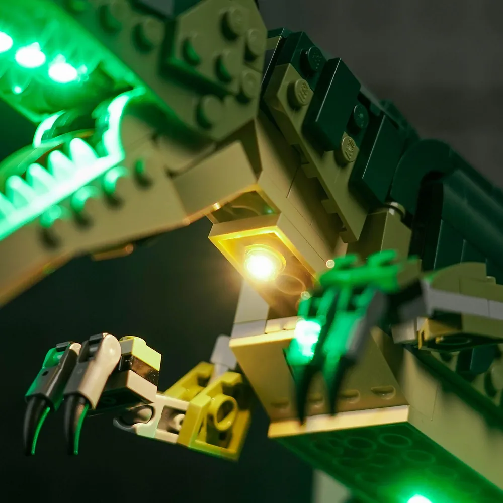 LEGO Creator T. rex 31151 with BrickBling light kit glowing against a dark background