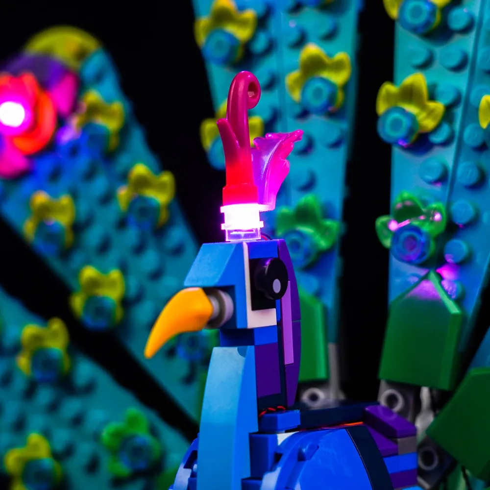 Close-up of BrickBling micro-LED wires on the LEGO peacock's wings