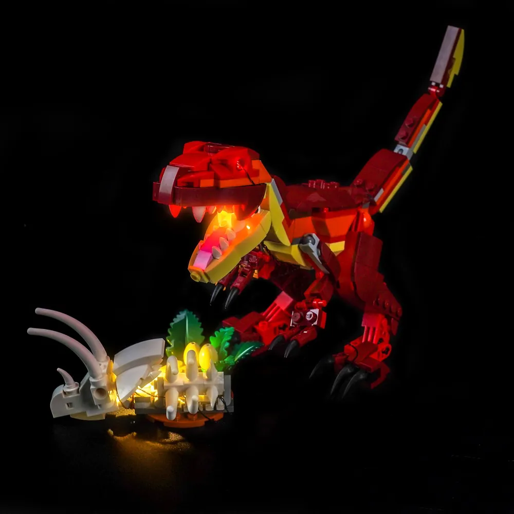BrickBling LED lights illuminating the LEGO Fierce Dinosaur raptor's open jaw and claws