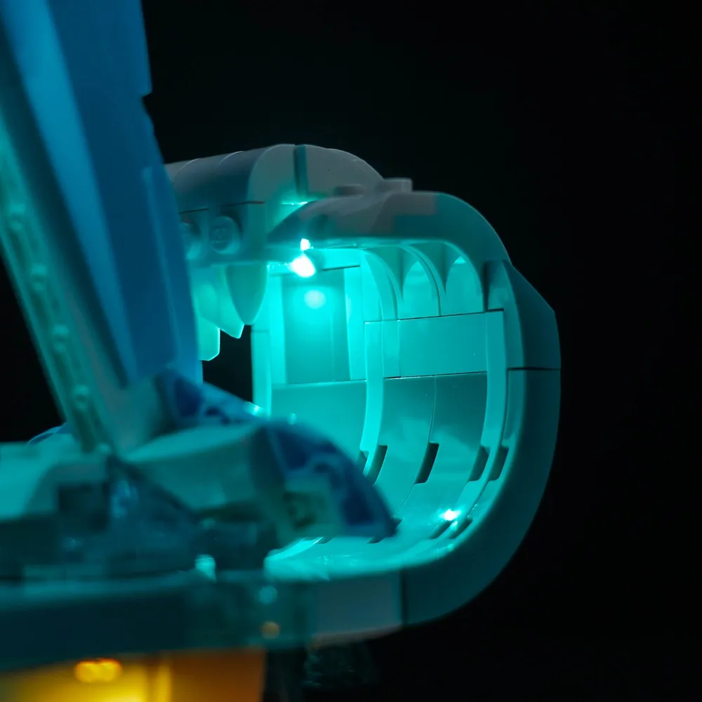 LEGO 31385 dolphins with BrickBling light kit glowing in dark room