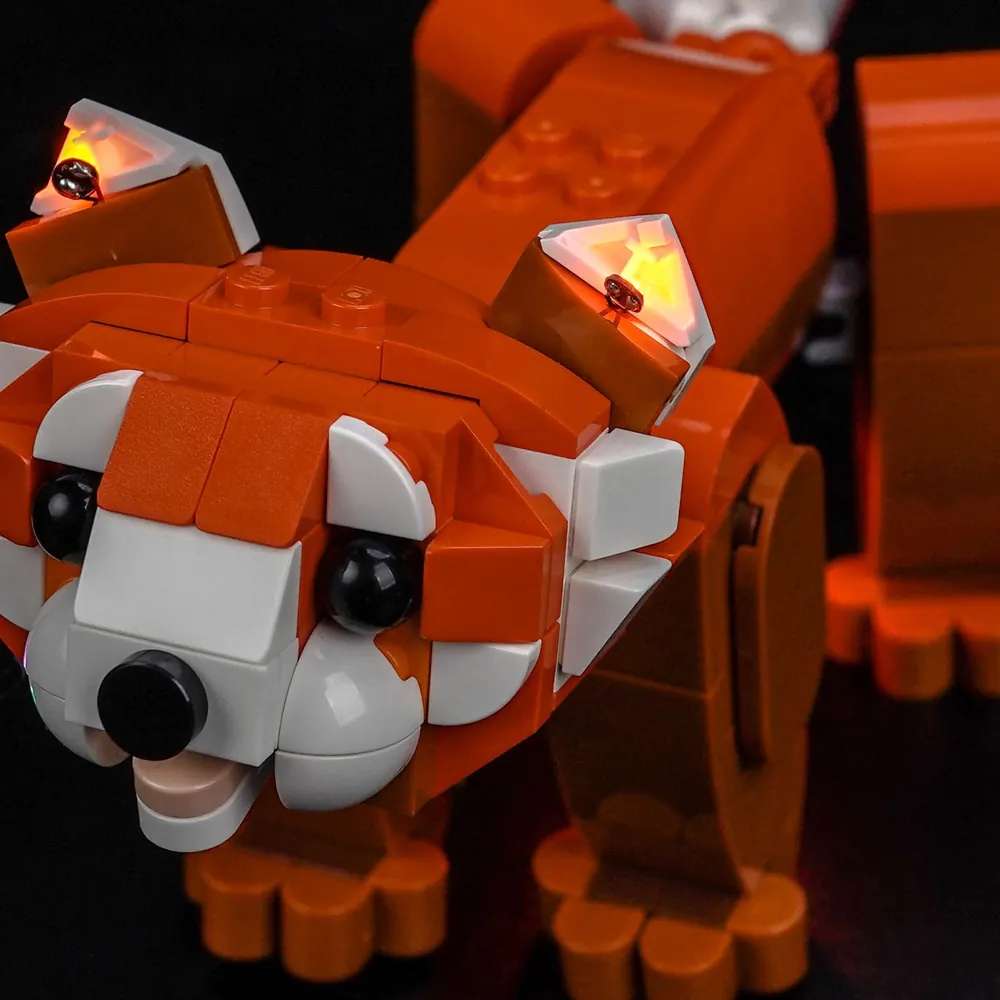 Close-up of BrickBling modular micro-LED wiring on LEGO Red Panda set