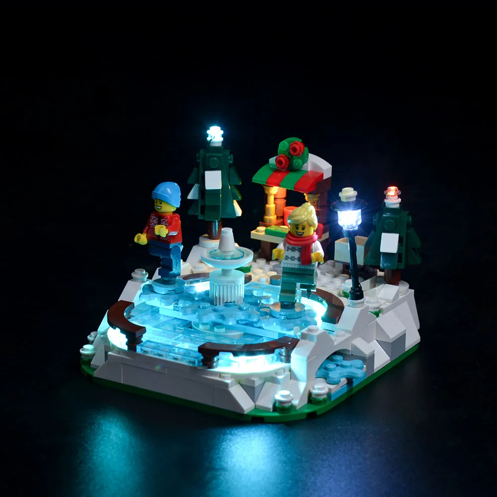 LEGO Ice Skating Rink 40416 lit with Game of Bricks LED kit showing fountain and rink perimeter glow