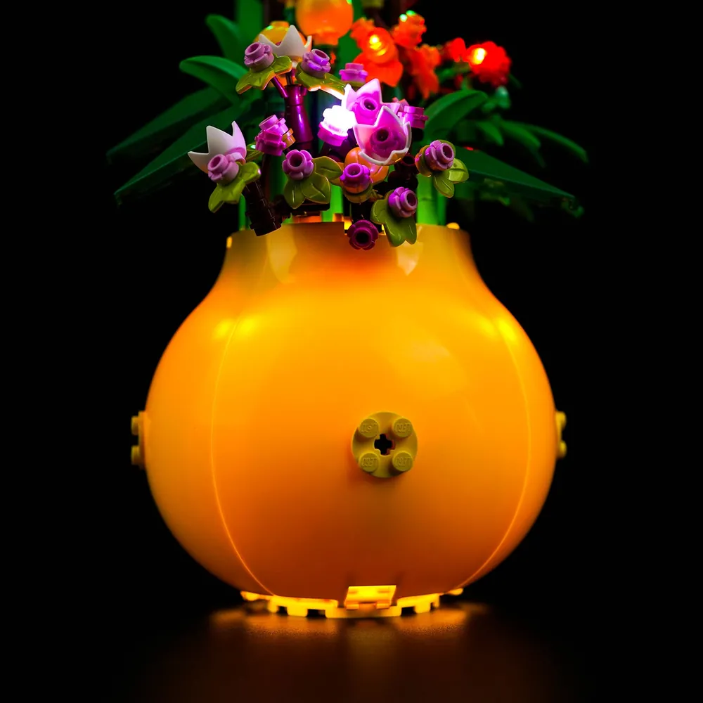 LEGO Flowerpot 40588 with BrickBling lights in a dark room