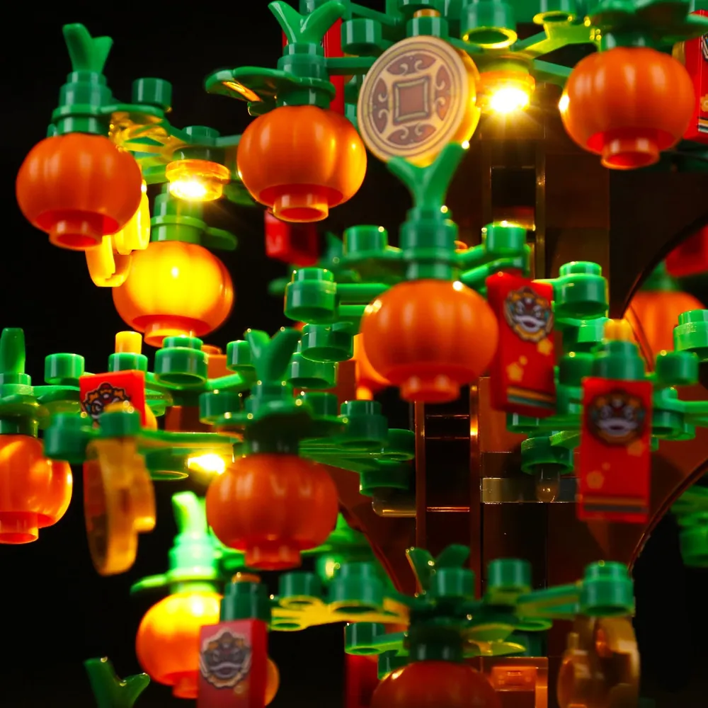 Close-up of BrickBling micro-LEDs illuminating golden coins on Money Tree