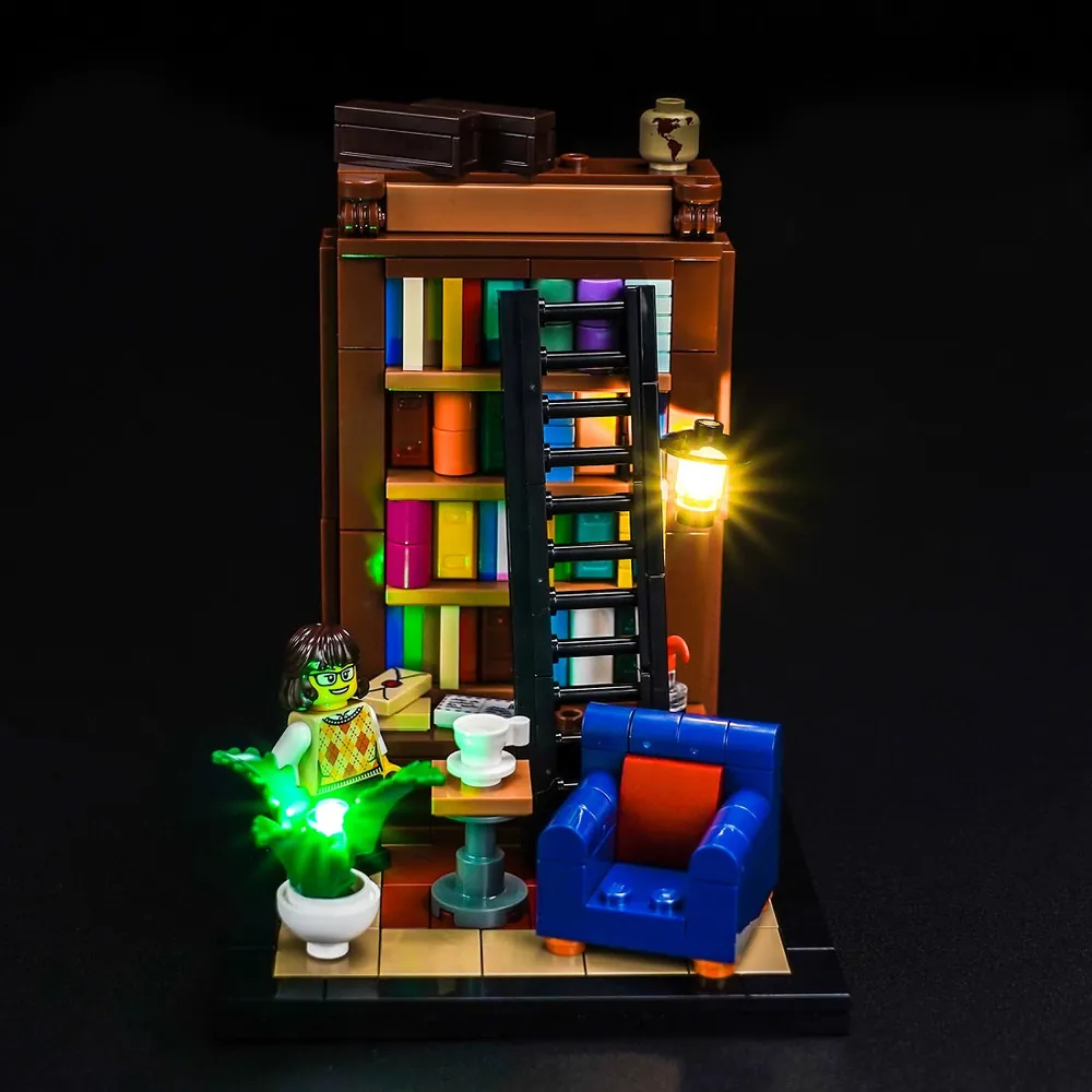 BrickBling LED kit for LEGO Ideas 40698 glowing on bookshelf