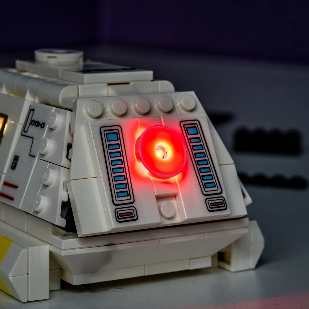 LEGO Type-15 Shuttlepod lit up in a dark display case with LED lights