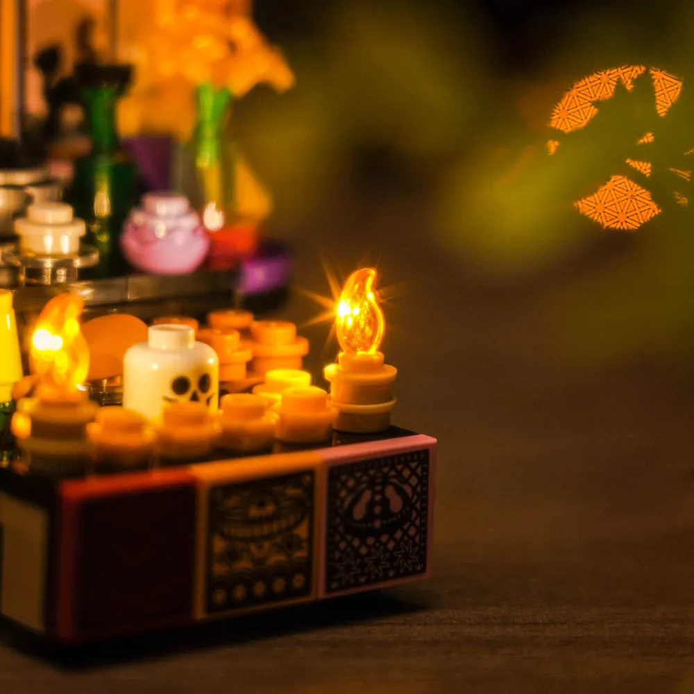Close-up of BrickBling modular micro-LEDs lighting the altar offerings on LEGO 40811