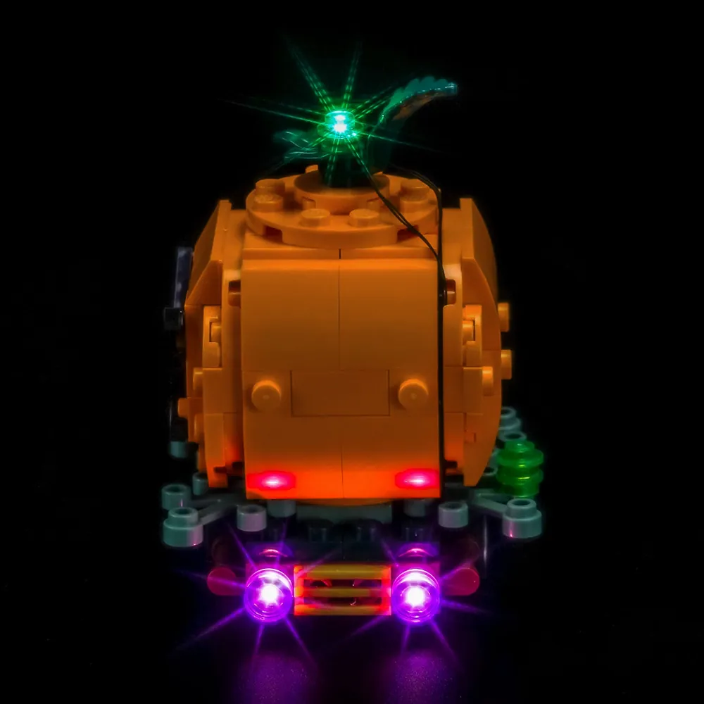 BrickBling LED kit installed on LEGO Jack-O'-Lantern Pickup Truck 40822 in a dark room