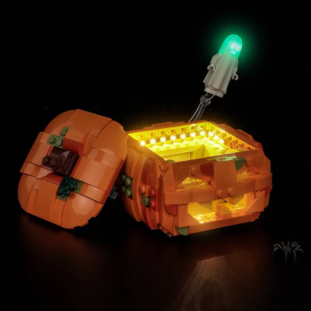 LEGO Halloween Pumpkin Lantern 40872 with BrickBling lights in a dark room