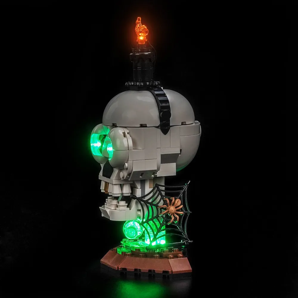 Dimly lit display of LEGO 40883 with BrickBling kit, emphasizing the eerie glow of the skull