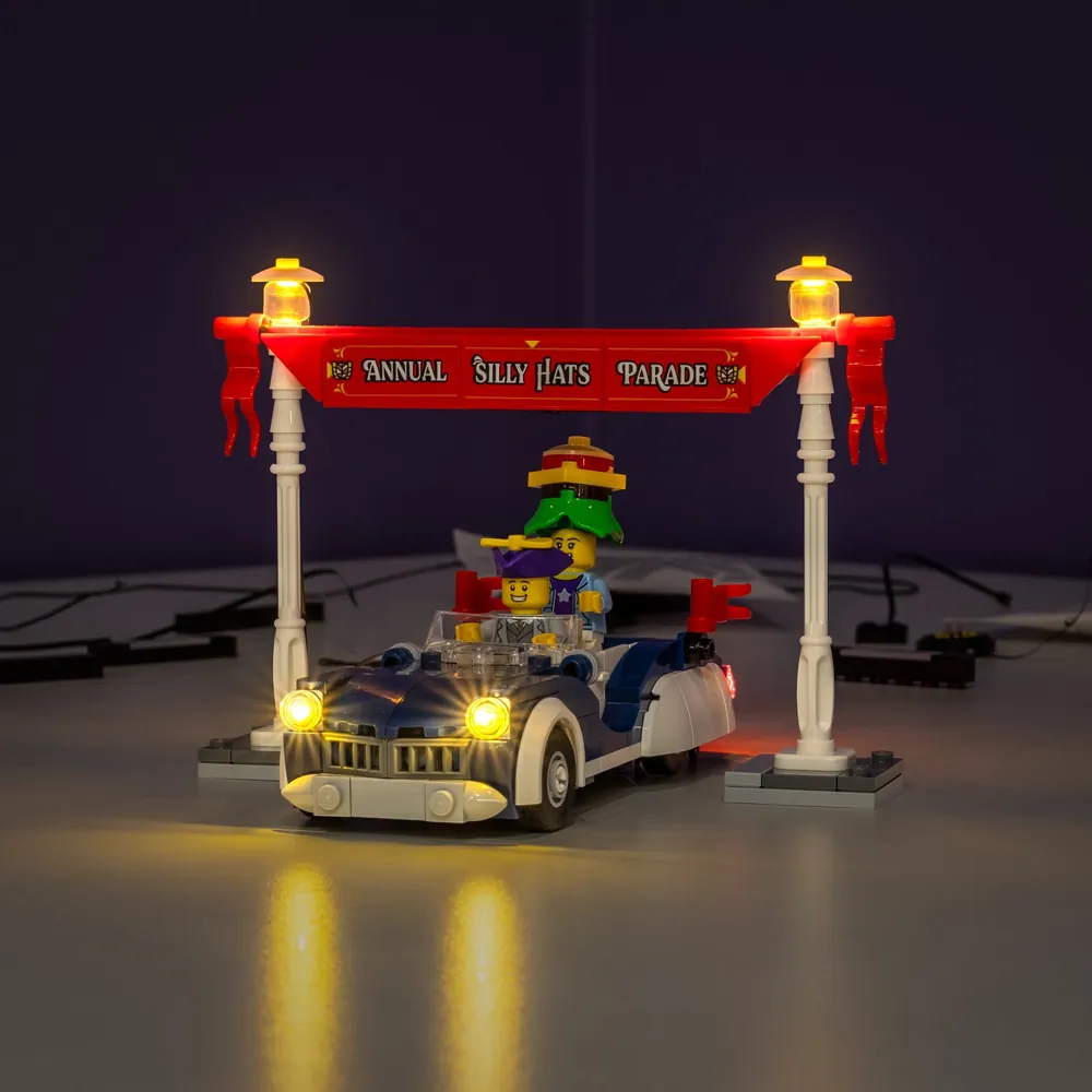 LEGO Vintage Parade Car 40913 lit with LightMyBricks kit showing warm headlights and taillights