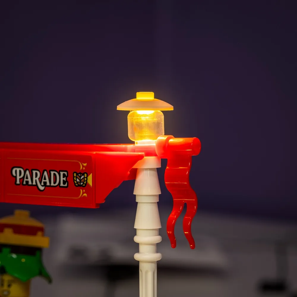 Display of LEGO Vintage Parade Car 40913 with all lights activated